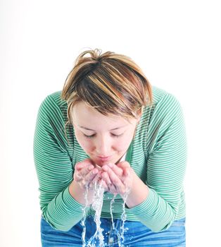 bautiful young woman wash face with clean water isolated on white in studio