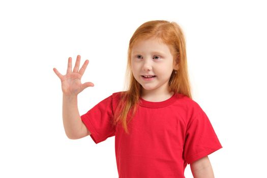 A little girl in a red t-shirt shows gesture - five fingers, isolated on white background. Children's emotions. Child looking away