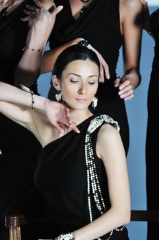 beautiful woman on fashion show piste with gold jawel