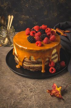 Delicious caramel cake with blackberries and raspberries.