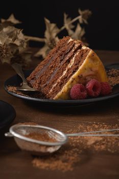 Delicious caramel cake slice with blackberries and raspberries.