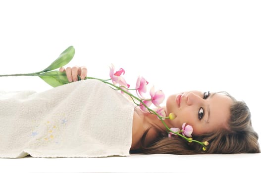 one  beautiful young  woman face with flower and towel