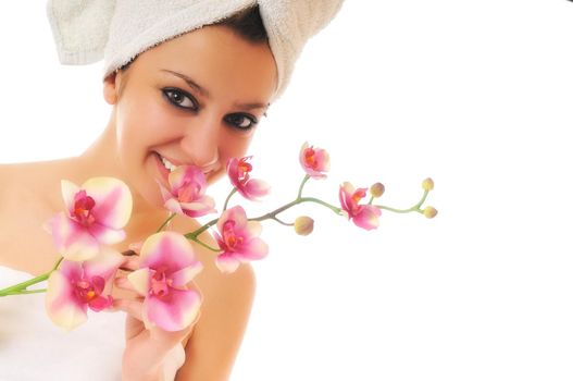 beauty halth and spa wellness isolated young woman face portrait closeup with towel and flower treatment