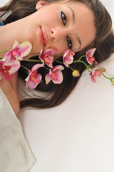 beauty halth and spa wellness isolated young woman face portrait closeup with towel and flower treatment