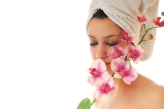 beauty halth and spa wellness isolated young woman face portrait closeup with towel and flower treatment