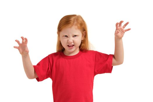 Portrait of cute redhead emotional little girl in red t-shirt isolated on a white. Beautiful studio portrait of female little caucasian person