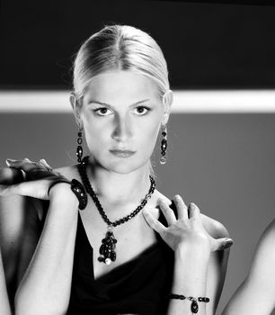 beautiful woman on fashion show piste with gold jawel
