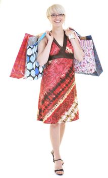 happy young adult women  shopping with colored bags  isolated over white background in studio