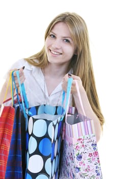 women shopping concept with young lady and colored bags  isolated over white background in studio