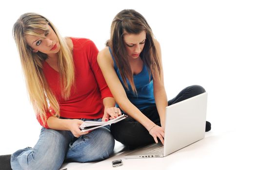 two young woman student work on laptop isolated