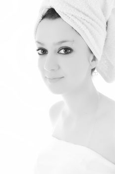 beauty halth and spa wellness isolated young woman face portrait closeup with towel and flower treatment