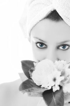 beauty halth and spa wellness isolated young woman face portrait closeup with towel and flower treatment