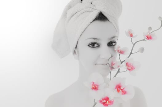 beauty halth and spa wellness isolated young woman face portrait closeup with towel and flower treatment