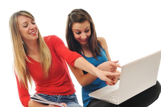 successful team two young happy  student girl work on laptop computer isolated on white