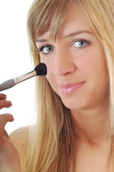beautiful young woman apply powder makeup with brush isolated on white