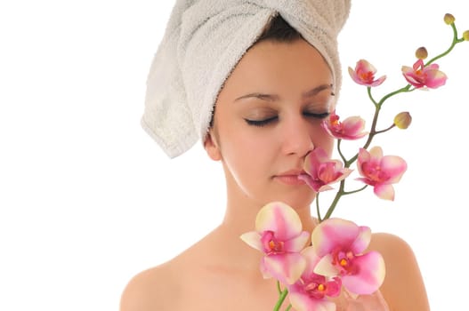 beauty halth and spa wellness isolated young woman face portrait closeup with towel and flower treatment