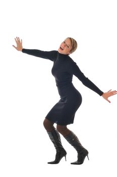 isolated happy woman in black dress and boots posing 
