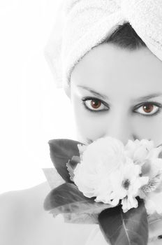 beauty halth and spa wellness isolated young woman face portrait closeup with towel and flower treatment