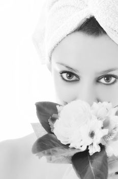 beauty halth and spa wellness isolated young woman face portrait closeup with towel and flower treatment