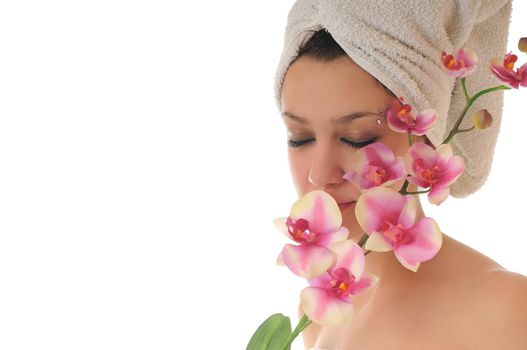 beauty halth and spa wellness isolated young woman face portrait closeup with towel and flower treatment