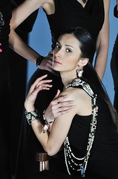 beautiful woman on fashion show piste with gold jawel
