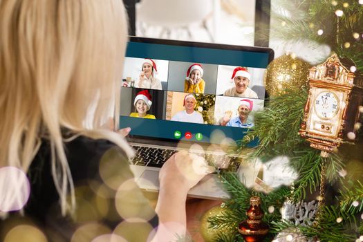 Attractive happy young girl student having video chat, waving. christmas.