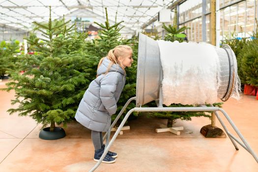 Christmas tree at a market and wrapping device