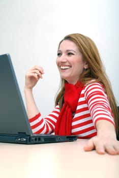 woman in red working on laptop at bright  office