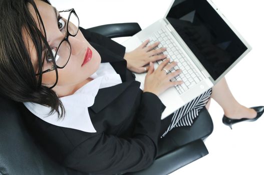 young beautiful business woman isolated on white workling on laptop computer