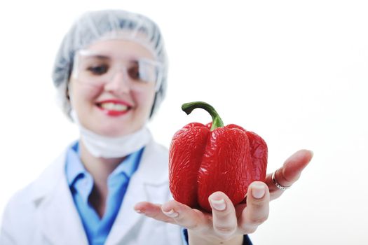 isolated on white young nurse doctor woman with red vegetable food papper representing bio food concept 