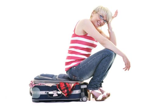 woman tourist packing travel bag isolated on white backgound in studio