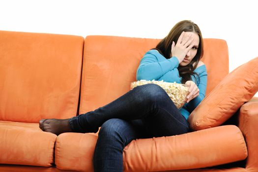 young woman eat popcorn, watching movies and eat popcor isolated on white