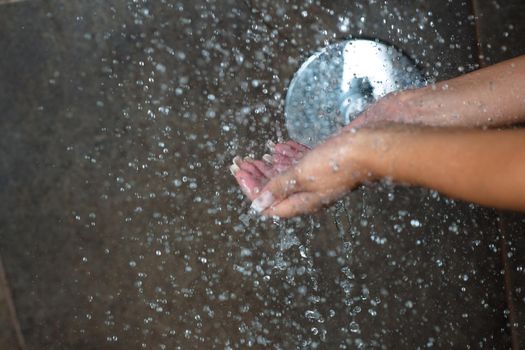 Portrait of a sexy young woman enjoing bath under water shower