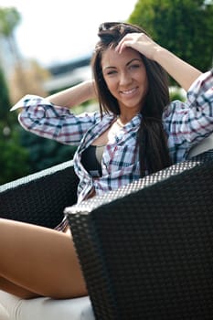 beautiful young woman lady posing in green moden outdoor garden