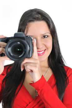 Young woman holding camera in hand taking picture isolated