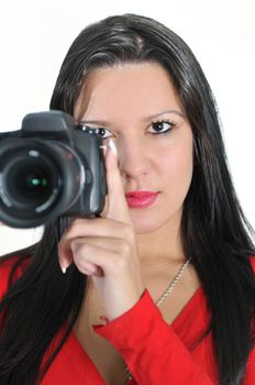 Young woman holding camera in hand taking picture isolated