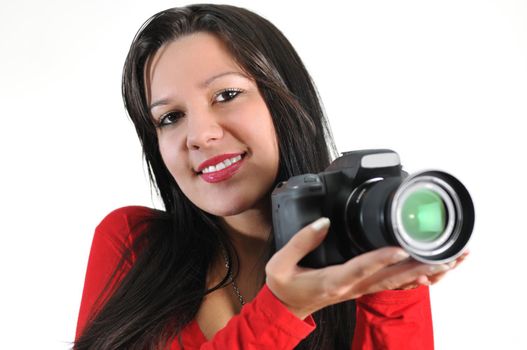 Young woman holding camera in hand taking picture isolated