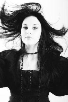 one brunette woman posing in studio 