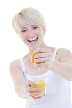 happy Young blonde woman squeeze  orange juice isolated over white background
