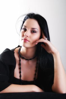 one brunette woman posing in studio 