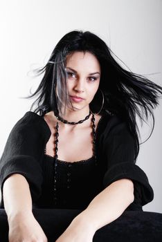 one brunette woman posing in studio 