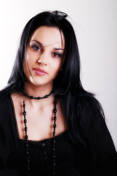 one brunette woman posing in studio 