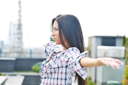 beautiful young woman lady posing in green moden outdoor garden