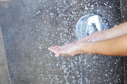 Portrait of a sexy young woman enjoing bath under water shower