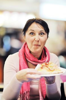 portrait of young woman eat pizza food at restaurant