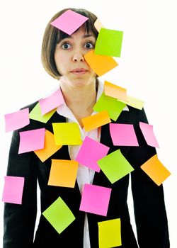 one frustrated young business woman with many of post it representing concept memory and frustration on work