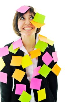 one frustrated young business woman with many of post it representing concept memory and frustration on work