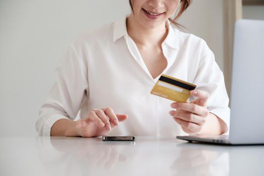 Woman using online banking to paying credit card bill. online payment concept