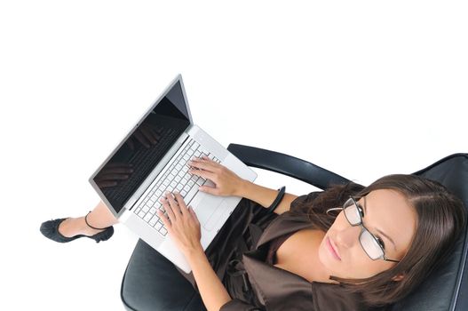 young beautiful business woman isolated on white workling on laptop computer
