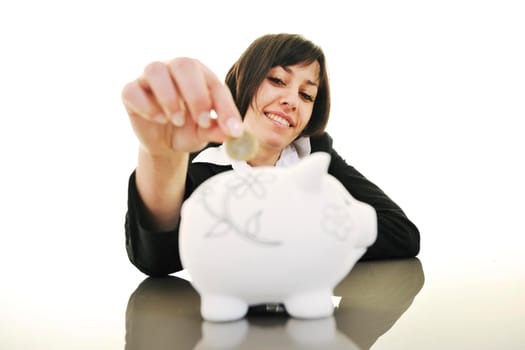 happy young business woman isolated on white puting euro money in piggy bank